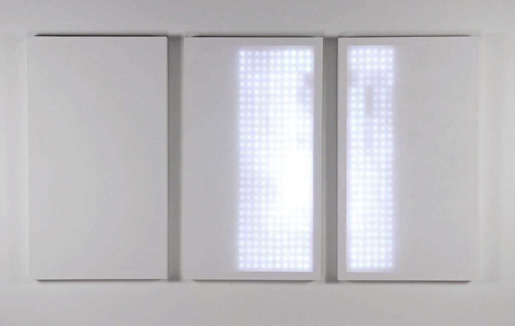 Joshua Penrose, _Untitled (Light Paintings: Triptych),_ 2018. Gesso, linen, RGB LEDs, electronics, computer software, 42 x 78 x 3 inches
