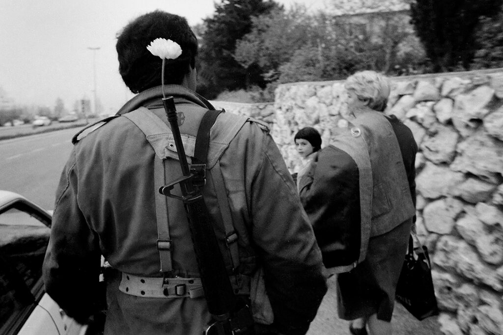 PV Skirball Faces of Israel 02 1985 haifa soldier shabbat flower bw