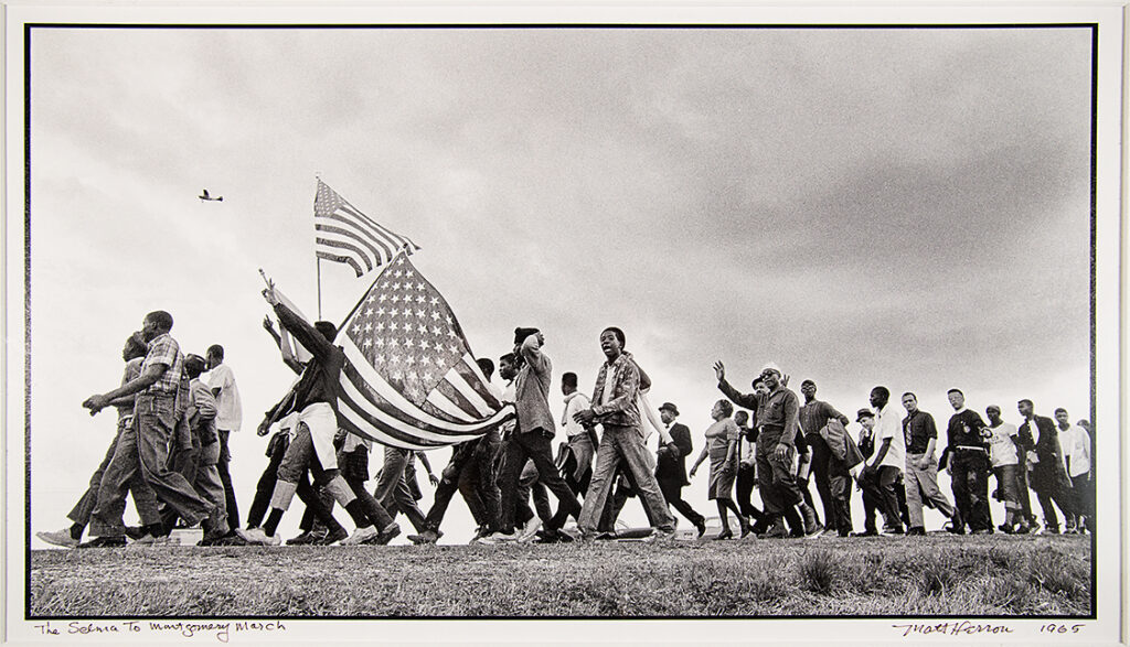 Matt Herron, _The Selma to Montgomery March_, 1965. Gelatin silver print, 20 × 24 inches. National Underground Railroad Freedom Center Collections 2025.020. © Estate of Matthew and Jeannine Herron NURFC Herron 1 NURFC Fall Fotofocus 5, FotoFocus